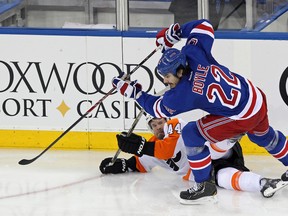 New York Rangers centre Brian Boyle (22) knocks Philadelphia Flyers defenceman Kimmo Timonen to the ice in Game 7 on April 30. (Adam Hunger-USA TODAY Sports)