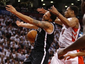 Raptors' DeMar DeRozan battles Nets' Deron Williams in Game 5 on April 30. (Craig Robertson/Toronto Sun/QMI Agency)
