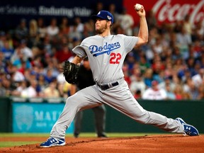 Los Angeles Dodgers pitcher Clayton Kershaw delivers a pitch against the Arizona Diamondbacks during the opening innings of the opening game the 2014 Major League Baseball season at the Sydney Cricket Ground March 22, 2014. (REUTERS/David Gray)