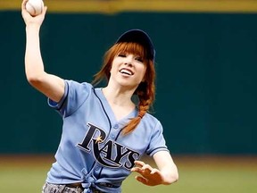 Singer Carly Rae Jepsen throws out the ceremonial first pitch just before the start of the game between the Tampa Bay Rays and the Houston Astros at Tropicana Field on July 14, 2013 in St. Petersburg, Florida. (J. Meric/Getty Images/AFP)