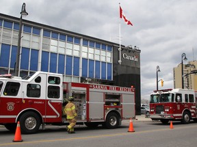 Sarnia firefighters respond to an alarm at the federal building downtown at Christina and Davis streets Thursday afternoon. Firefighters were searching the building to try and determine the source. Officials suspected it was a false alarm. TYLER KULA/ THE OBSERVER/ QMI AGENCY
