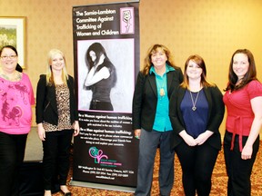 Thursday's Human Trafficking: A Community Response conference took a look at issues surrounding trafficking in Sarnia and Lambton County.  From left are Bridgette Perrier, Tricia Van Oosterom, Theresa Edwards, Chantel Butterfield and  Const. Jackie Henry. Carl Hnatyshyn/QMI Agency