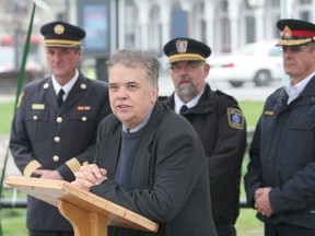 Kingston city councillor Jim Neill talks about the value of  emergency service workers at a ceremony Thursday in Confederation Park in Kingston to mark the inaugural First Responders Day.
ELLIOT FERGUSON/KINGSTON WHIG-STANDARD/QMI AGENCY