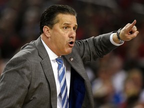 Kentucky Wildcats head coach John Calipari calls out to his players in the first half during the semifinals of the Final Four in the 2014 NCAA Mens Division I Championship tournament against the Wisconsin Badgers at AT&T Stadium on Apr 5, 2014 in Arlington, TX, USA. (Robert Deutsch/USA TODAY Sports)