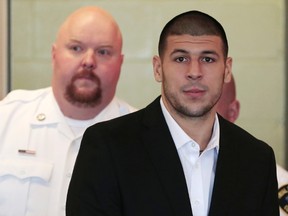Aaron Hernandez, former player for the NFL's New England Patriots football team, arrives in the courtroom for his arraignment in Fall River, Massachusetts in this file photo taken September 6, 2013. (REUTERS/Jonathan Wiggs/Files)