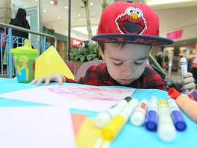 Micheal Palmer, 2, goes to work during a public art party held during National Youth Arts Week at Portage Place Shopping Centre in Winnipeg, Man., on Thu., May 1, 2014. Kevin King/Winnipeg Sun/QMI Agency