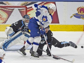 Marlies winger Carter Ashton can’t finish off the deflection as Joe Piskula (7) of the Milwaukee Admirals gets his stick on the puck first during last night’s AHL playoff game at the Ricoh Coliseum. The Marlies won 2-0 to sweep the best-of-five opening round. (Jack Boland, Toronto Sun)