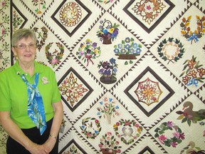 Annette Angood poses with her quilt Little Brown Bird at the Stitches In Bloom Quilt Show presented by the Chatham-Kent Quilters' Guild at St. Paul's Congregational Church on Friday and Saturday. The quilt won Best In Show.