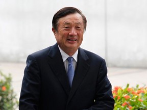 Huawei CEO and founder Ren Zhengfei walks inside Huawei's headquarters in the southern Chinese city of Shenzhen, Guangdong province, in this Oct. 16, 2013 file photo. REUTERS/Bobby Yip