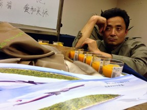 A relative of a passenger onboard Malaysia Airlines Flight MH370 sits inside a prayer room at Lido Hotel in Beijing May 2, 2014. Malaysia Airlines on Friday had put up notices to shut down service centres and stop providing accommodation for family members of passengers aboard the missing Flight MH370 in China. On Thursday, Malaysia released its most comprehensive account yet of what happened to missing Flight MH370, detailing the route the plane probably took as it veered off course and the confusion that followed. REUTERS/Jason Lee