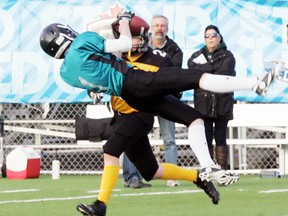 Blake Sokulski of the Parkland Predators goes sideways to haul in this pass from quarterback Colby Henkel during action in their semifinal game against the Leduc Cats on April 25. The Predators built up a substantial halftime lead and cruised to the win that advanced them to the Tier 2 championship game this Saturday, May 3, at Fuhr Field in the Grove at 7:30 p.m. - Gord Montgomery, Reporter/Examiner