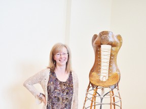 Kelly Johner shows one of her sculptures from the show, Figuratively Farm, which is at the Multicultural Heritage Centre until May 21. - April Hudson, Reporter/Examiner