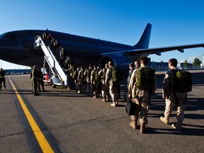 FILE: Soldiers make their way to a waiting airplane at the Shell Aerocentre in Nisku, Alta., on Monday, June 17, 2013. Approximately 50 troops departed from the Edmonton International Airport as part of the last deployment of Canadian Soldiers to Afghanistan. Codie McLachlan/Edmonton Sun