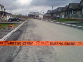 Police tape blocks off a portion of Canard Rd., in the Aylmer section of Gatineau Friday morning. Cops are investigating a suspected stabbing. (DANIELLE BELL Ottawa Sun)