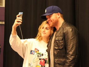 Hailey Weibe does not hesitate to snap a quick selfie with Spruce Grove Composite High School graduate, guest speaker and Hollywood actor Josh Emerson after an hour-long question and answer period with the school’s drama students on April 23. - Karen Haynes, Reporter/Examiner