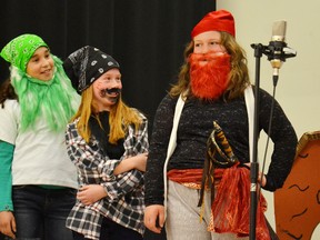 Jenna Deck, Danielle Vogels and Rene Sousa, as Greenbeard, Blackbeard and Redbeard, debate what must be done with the stowaway during St. Columban Catholic School's presentation of Pirates! The Musical.