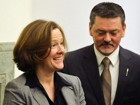 Former premier Alison Redford (L) and Minister of Finance Doug Horner leave the house following Horner's budget speech in the Alberta Legislature in Edmonton March 7, 2013.  REUTERS/Dan Riedlhuber (CANADA - Tags: BUSINESS POLITICS)