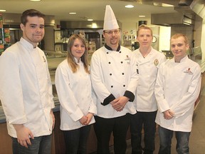 Standing in the Leonard Hall dining hall with executive chef Drew Carroll, centre, are LCVI Cook's Internship focus program students, from left, Nick Edwards, Sarah Giddy, Justin Whidden and Chris Tibbutt. 
MICHAEL LEA\THE WHIG STANDARD\QMI AGENCY