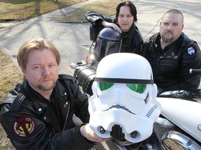 Dallas Howlett (left) along with Tom Wenzoski (c) and Marty Barton display Star Wars  helmets in Winnipeg, Man. Thursday May 1, 2014. The trio are involved in a comic book celebration this weekend. (Brian Donogh/Winnipeg Sun)