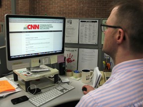 Observer senior news editor Jack Poirier checks out the new MyCNN community notification website. The system allows local residents to receive phone and text notifications about potential safety hazards. (The Observer)
