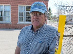 Retired teacher and concerned citizen Rick Munroe above a gas pipeline in Kingston that is next to W.J. Holsgrove Public School in Westbrook.
PAUL SCHLIESMANN/KINGSTON WHIG-STANDARD/QMI AGENCY
