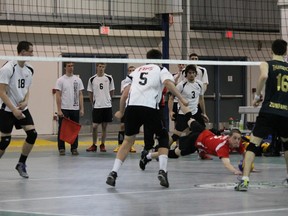 Nathan Phelps of the London Volleyball Club?s under-18 boys? team pancakes a ball to keep it alive during the Ontario Volleyball Association championship last weekend in Waterloo. LVC took the silver medal. (Special to The Free Press)