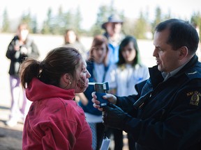 Emergency crews demonstrate how an accident victim may be resuscitated at a crash site during Mannville School's 'It Can't Happen to Me' a day that shows students the dangers of impaired and distracted driving, both in the long-term and short-term.