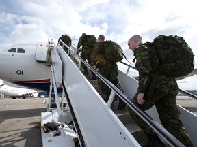 Fifty soldiers from the 3rd Battalion, Princess Patricia's Canadian Light Infantry board a military plane at the Shell Aerocentre in Edmonton, Alta., on Friday, May 2, 2014. The soldiers are deploying to Poland as part of Exercise Orzel Alert, in response to the ongoing crisis in the Ukraine. 

Ian Kucerak/QMI Agency