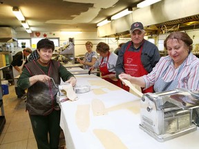 JOHN LAPPA/THE SUDBURY STAR
Rosa Camilli, left, Mario Zuliani and Beatrice Pigozzo make crostoli dough at the Caruso Club in preparation for a dinner at the club on Sunday. The Societa Caruso Culture and Education Committee is hosting the fettuccine and chicken dinner fundraiser at the Caruso Club. Takeout is from 2:30-5 p.m., while the dinner starts at 5 p.m.