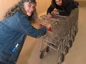 Danielle Tremblay (left) and Daniel Aubin (right) from La Galerie du Nouvel-Ontario play with shopping carts that will soon be used by 30 contemporary artists during FAAS (Fair of Alternative Art in Sudbury). Each artist has been asked to incorporate a shopping cart into their piece of work for the fair's fourth year. Photo by Solana Cain
