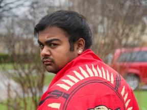Kumar Makandu displays a controversial Tamil flag he hoped to carry during an annual multicultural assembly held Friday at London?s Central secondary school. The Grade 12 student says the flag isn?t connected to the militant group Liberation Tigers. Mike Hensen/The London Free Press