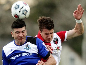 FC Edmonton's Frank Jonke (13) battles Ottawa Fury FC's Mason Trafford (3) during NASL first half action at Clarke Stadium, in Edmonton Alta., on Wednesday April 30, 2014.David Bloom/Edmonton Sun/QMI Agency