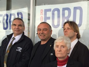 Three candidates running for council — Arthur Smitherman (L), John Papadakis, and Paul Bell - stand outside Ford's campaign office Saturday as volunteers clap and cheer.