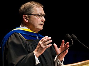 Former Premier Ed Stelmach speaks to students after being awarded an honorary degree for a Bachelor of Business Administration during NAIT's 2014 convocation ceremony at the Northern Alberta Jubilee Auditorium in Edmonton, Alta., on Saturday, May 3, 2014. Codie McLachlan/Edmonton Sun/QMI Agency