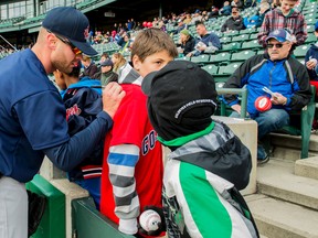 Goldeyes infielder Josh Mazzola signs autographs for a couple of young fans at the Goldeyes Open House, Saturday at Shaw Park. TARA MILLER/Winnipeg Goldeyes