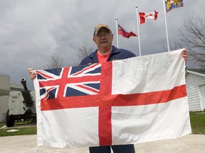 Don Ramsey, Zone Commander of Zone F-2 hoists the flag at Cobourg Legion Branch 133 on Friday, May 2, 2014 in Cobourg, Ont. Every year the 1st Sunday in May is recognized as Battle of Atlantic Sunday to commemorate the longest unbroken Battle of World War II from early September 1939 until May 8th 1945. The Royal Canadian Navy lost 24 Warships and over 2,000 men as well as 1,700 Merchant Navy personnel. (Pete Fisher/QMI Agency)