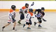 Vulcan Viking Beau Gardner — wearing a Hawks jersey until the squad’s new uniforms arrive — tries to scoop the ball and move it towards Brooks’ zone Saturday morning during the team's first-ever lacrosse game at the Vulcan District Arena. The novice squad lost 4-0, but nevertheless did really well considering most of the players have no lacrosse experience, said coach Todd Olson.
Simon Ducatel Vulcan Advocate