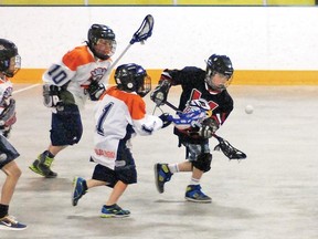 Vulcan Viking Beau Gardner — wearing a Hawks jersey until the squad’s new uniforms arrive — tries to scoop the ball and move it towards Brooks’ zone Saturday morning during the team's first-ever lacrosse game at the Vulcan District Arena. The novice squad lost 4-0, but nevertheless did really well considering most of the players have no lacrosse experience, said coach Todd Olson.
Simon Ducatel Vulcan Advocate