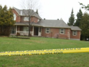 Ottawa cops searched this upscale west-end home Sunday, May 4, 2014 after a woman and her daughter were attacked by a man with a butcher knife. The man is in custody and the girl's finger had to be re-attached at hospital Saturday night. DOUG HEMPSTEAD/QMI AGENCY
