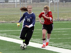 Sara Falvo or Marymount, left, and Lindsey Hodgins of St. Charles battle for the ball during the Lady Gator Invitational Girls High School Soccer Tournament championship final, played at James Jerome Sports Complex on Saturday afternoon.