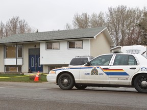 Police were on scene at the home, where police say Rienna Nagel, 36, was found dead, is seen in Spruce Grove, Alta., on Sunday, May 4, 2014. Christopher Ray Nagel, 36, is charged with first degree murder in the death of his wife said RCMP Cpl. Colette Zazulak conducted an investigation after they were called to the house, in Spruce Grove, on May 3, 2014 at 8 a.m., where they found Rienna Nagel deceased. Ian Kucerak/Edmonton Sun/QMI Agency
