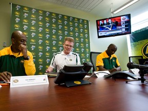 (L to r) Edmonton Eskimos head scout Ed Hervey, general manager Eric Tillman and head coach Kavis Reed preapare for the start of the 2012 CFL draft at Commonwealth Stadium in Edmonton, Alberta, on May 3, 2012. IAN KUCERAK/EDMONTON SUN/QMI