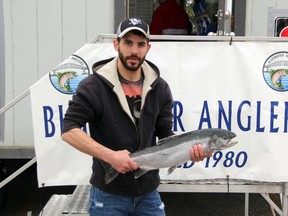Pat Humphrey of Sarnia poses with the 7.44 pound rainbow trout he entered in the 38th Annual Bluewater Angler's Salmon Derby. Humphrey caught the fish just before noon on Sunday, May 4 under the Bluewater Bridge. SHAUN BISSON/THE OBSERVER/QMI AGENCY