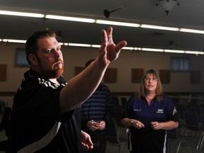 Tom Smith, Bradley Smith and Marjorie Allardyce play a round of darts in Legion 613.  Both Bradley and Marjorie have been to nationals for darts, and now its Tom's turn. He will be traveling to Nova Scotia later this year for the nationals.  (Justin Greaves/ For The Whig-Standard)