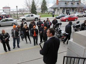 Kingston Mayor Mark Gerretsen declaring the month of May to be motorcycle safety and awareness month, in conjunction with the Keep An Eye Out for Motorcyclists campaign, at a ceremony outside City Hall on Saturday. (Julia McKay/The Whig-Standard)