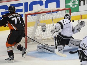 Los Angeles Kings goalie Jonathan Quick makes a save on Anaheim Ducks right wing Devante Smith-Pelly during Game 1 of their Western Conference semifinal series. (Jayne Kamin-Oncea/USA TODAY Sports)