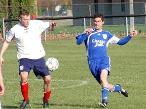 Wallaceburg Sting senior men's soccer player Ryan Nowakowski, right, battles a White Eagles player during the Sting's Western Ontario Soccer League First Division regular-season opener played on May 3 at Kinsmen Park. The Sting won 4-3, with Mike Foster scoring a goal in the last two minutes to break up a 3-3 tie. Other Sting goal scorers included; Mark Foster, Phil Nywening and Nowakowski