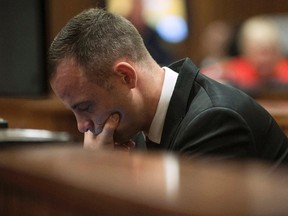 Olympic and Paralympic track star Oscar Pistorius sits in the dock in the North Gauteng High Court in Pretoria May 5, 2014. (REUTERS/Ihsaan Haffejee/Pool)