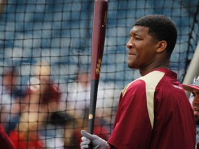 Florida State Seminoles pitcher/outfielder Jameis Winston (44) works out prior to the game against the New York Yankees at George M. Steinbrenner Field on Feb 25, 2014 in Tampa, FL, USA. (Kim Klement/USA TODAY Sports)