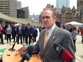 Deputy Mayor Norm Kelly speaks to reporters on Monday. (DON PEAT/Toronto Sun)